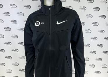 Nike NN Running Team Pro Elite 2024 Storm Fit Tracksuit black jacket side front view with NN Running logo and Nike swoosh visible