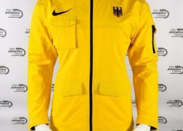 Nike Germany Pro Elite 2023 Women Storm Jacket yellow front view showing black Nike swoosh and German eagle crest on mannequin