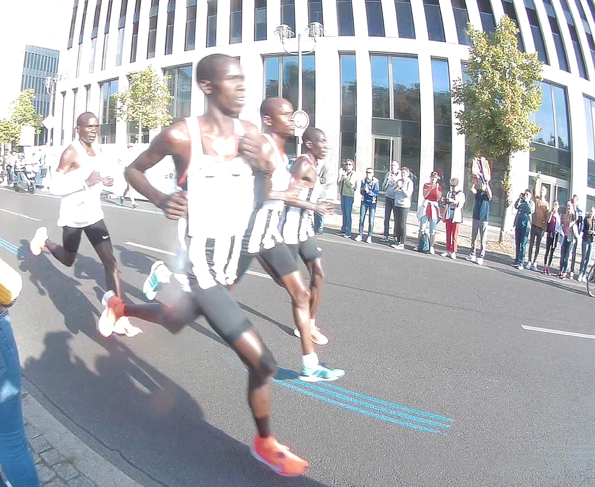 Eliud Kipchoge racing through Berlin in Nike kit during his 2018 world record marathon
