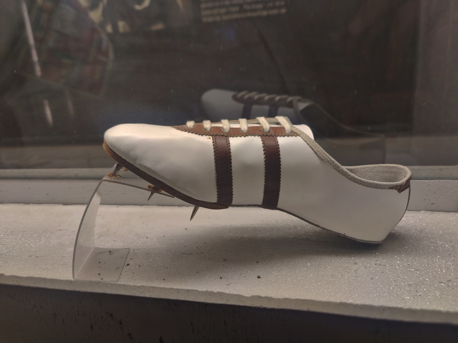 The spikes Jesse Owens competed in during 1936, preserved in a display case