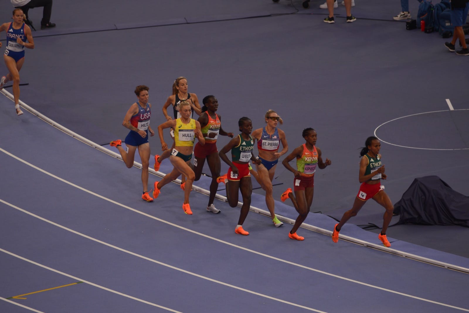 The women's 1500 metres final at the Paris 2024 Olympics, the field in national team kit