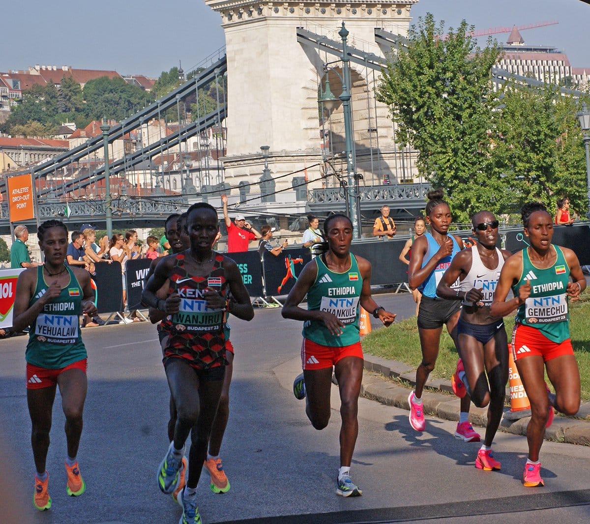 The lead pack of the women's marathon crossing the Chain Bridge at the Budapest 2023 World Championships