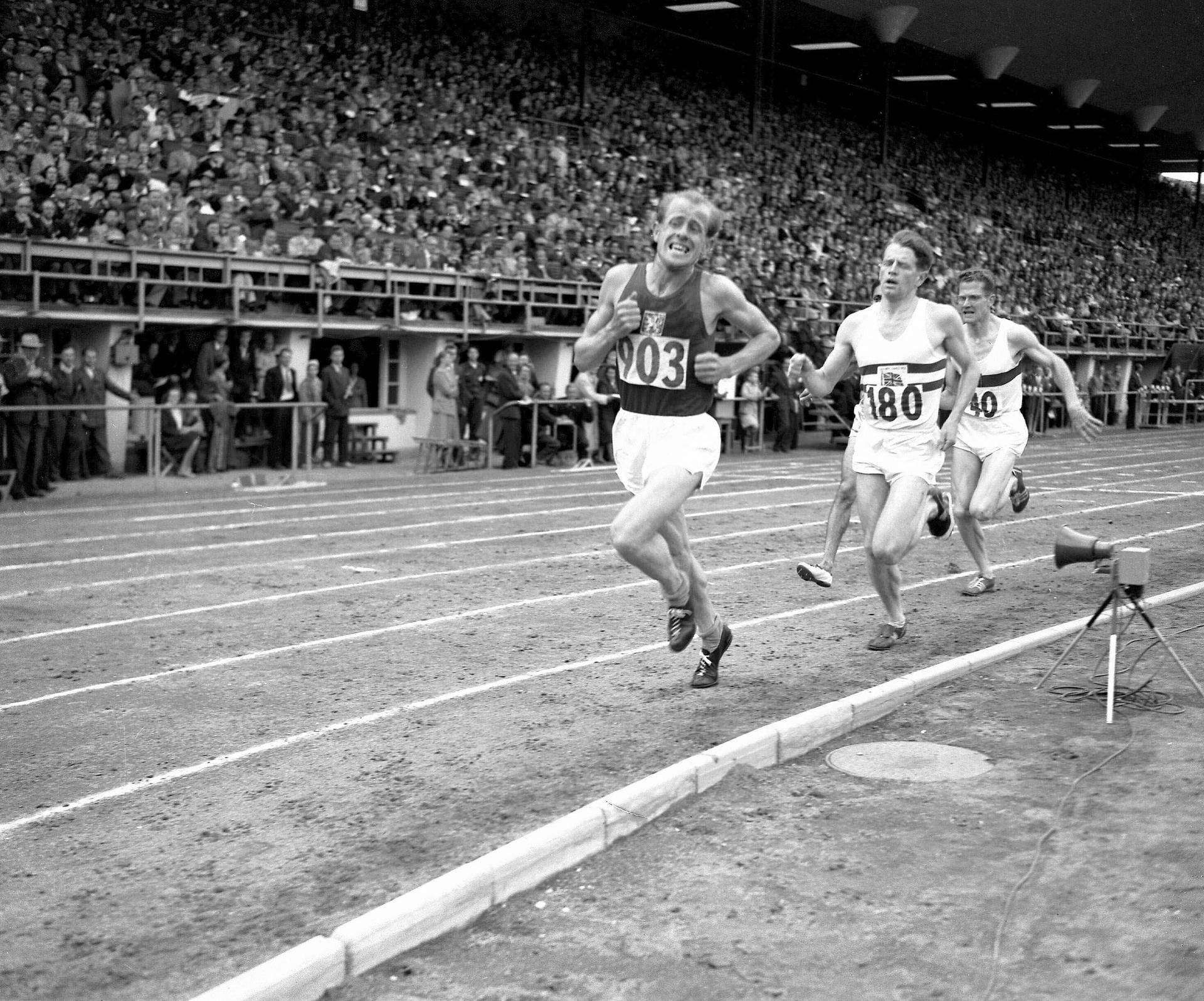 Emil Zátopek leading the 5,000 m final at the Helsinki 1952 Olympics