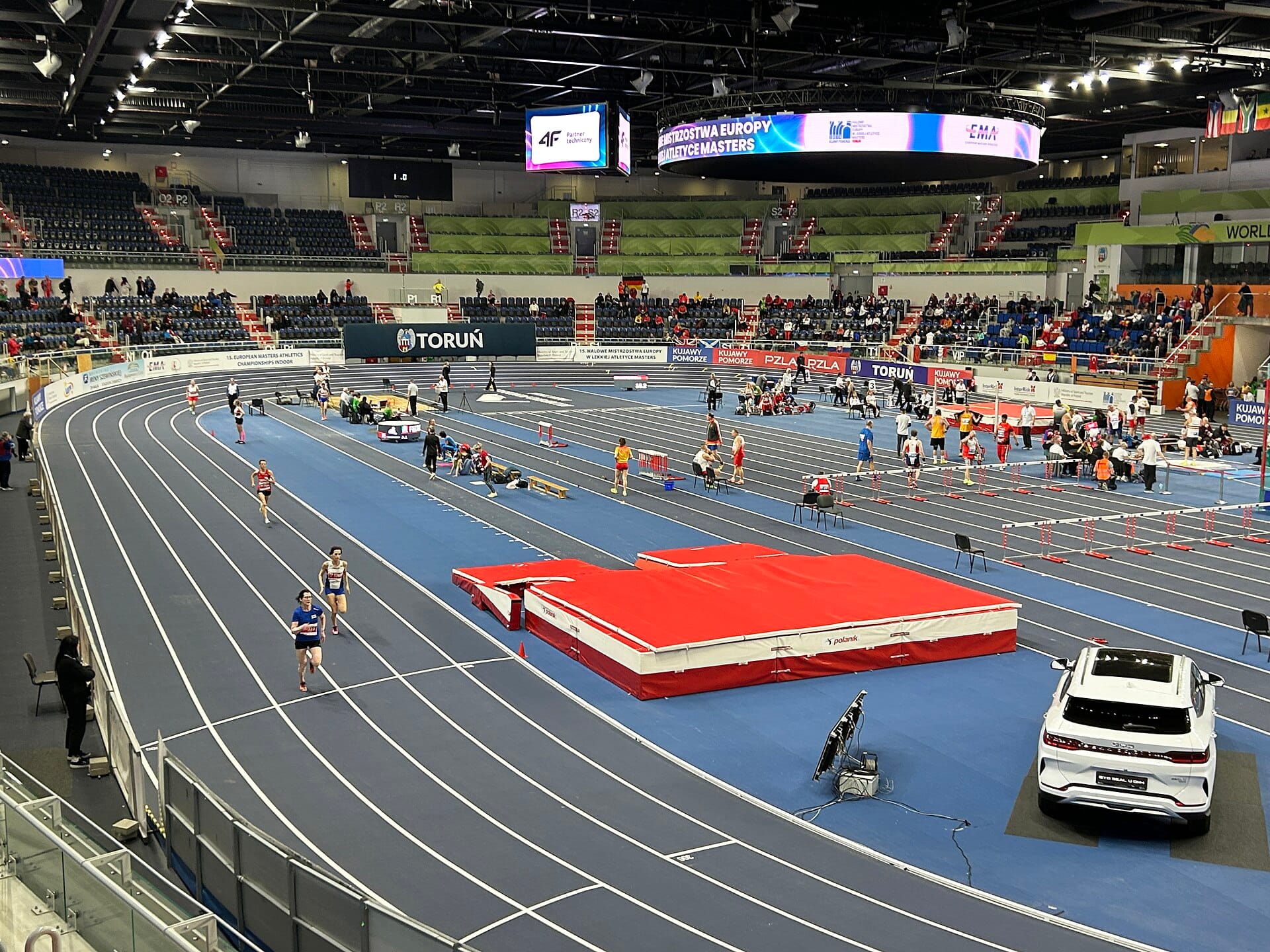 The banked indoor track of the Torun arena during a 2026 championship