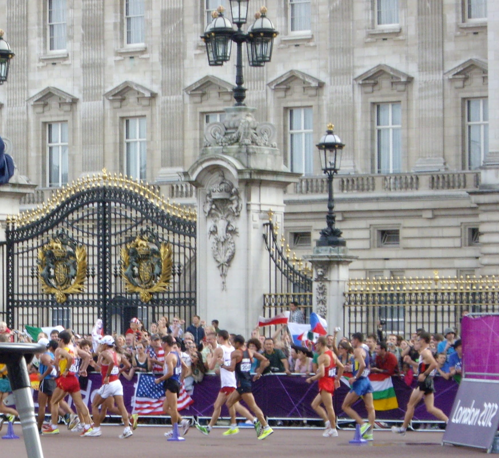 Competitors in the 2012 Olympic race walk passing the gates of Buckingham Palace in London