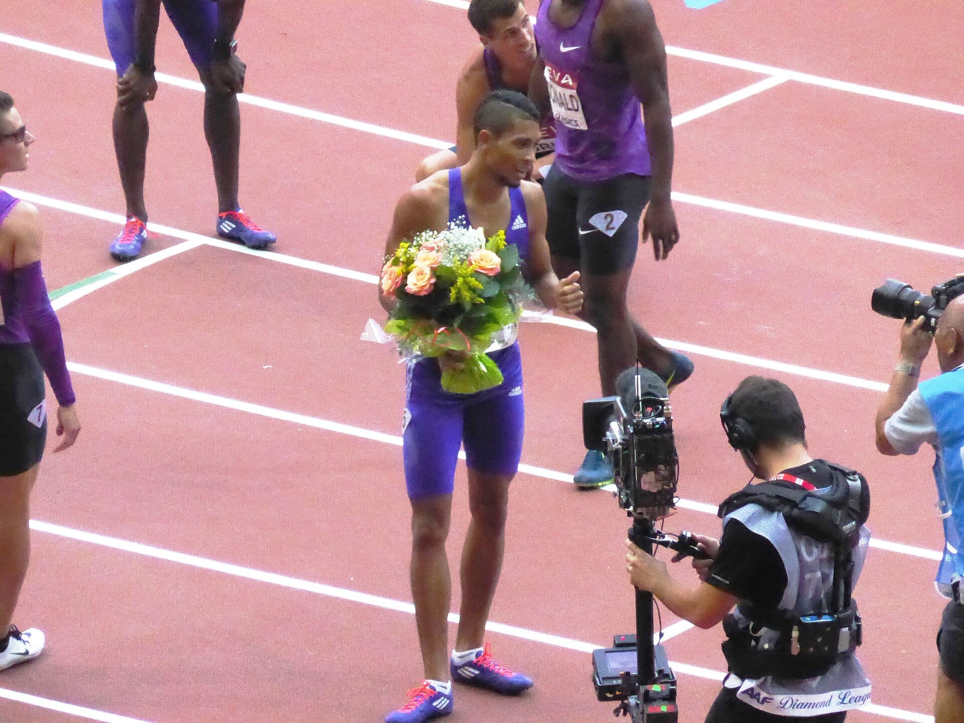 The Stade de France under lights during a summer evening athletics meeting in Paris