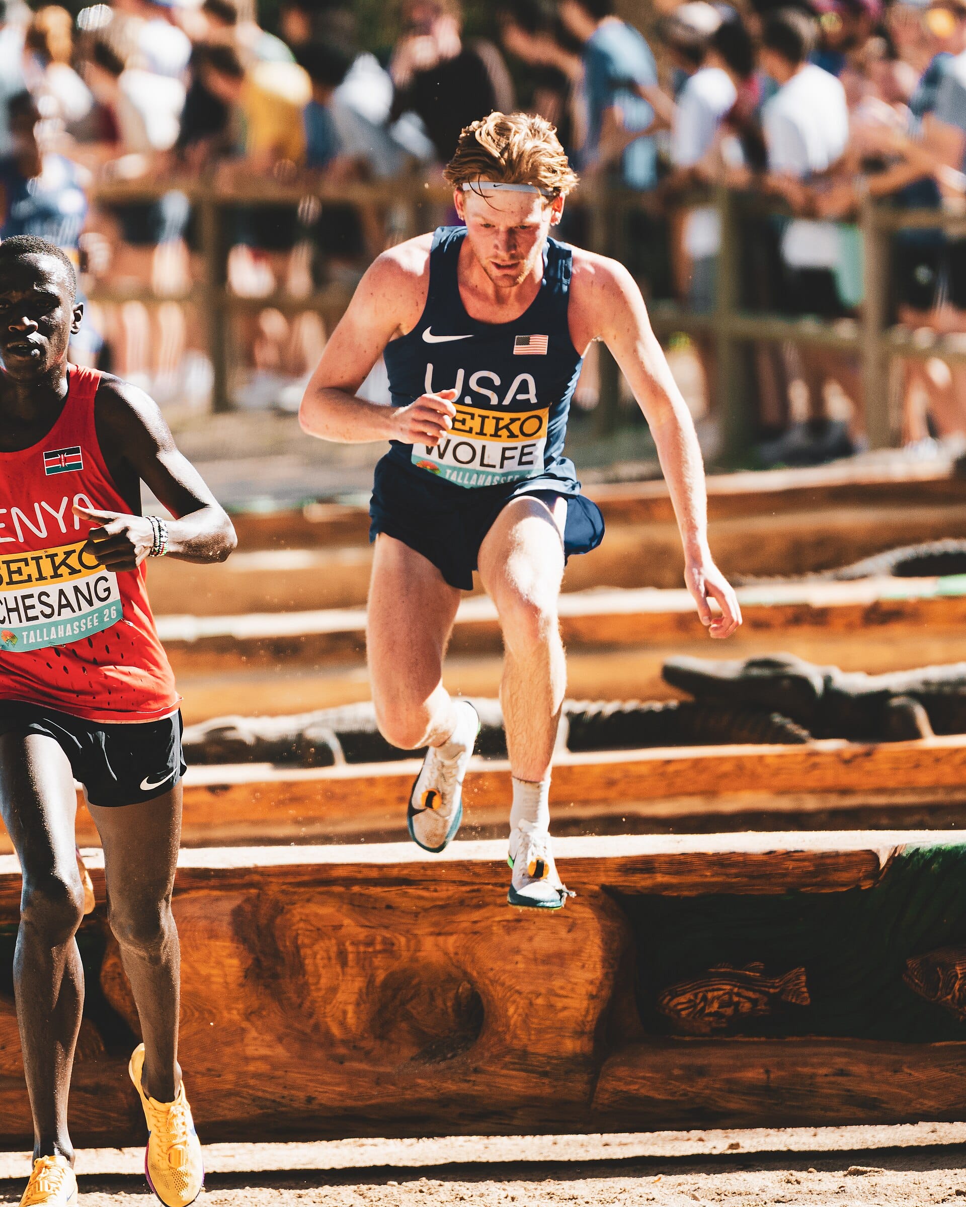 Parker Wolfe racing over the grass course at the 2026 World Cross Country Championships in Tallahassee