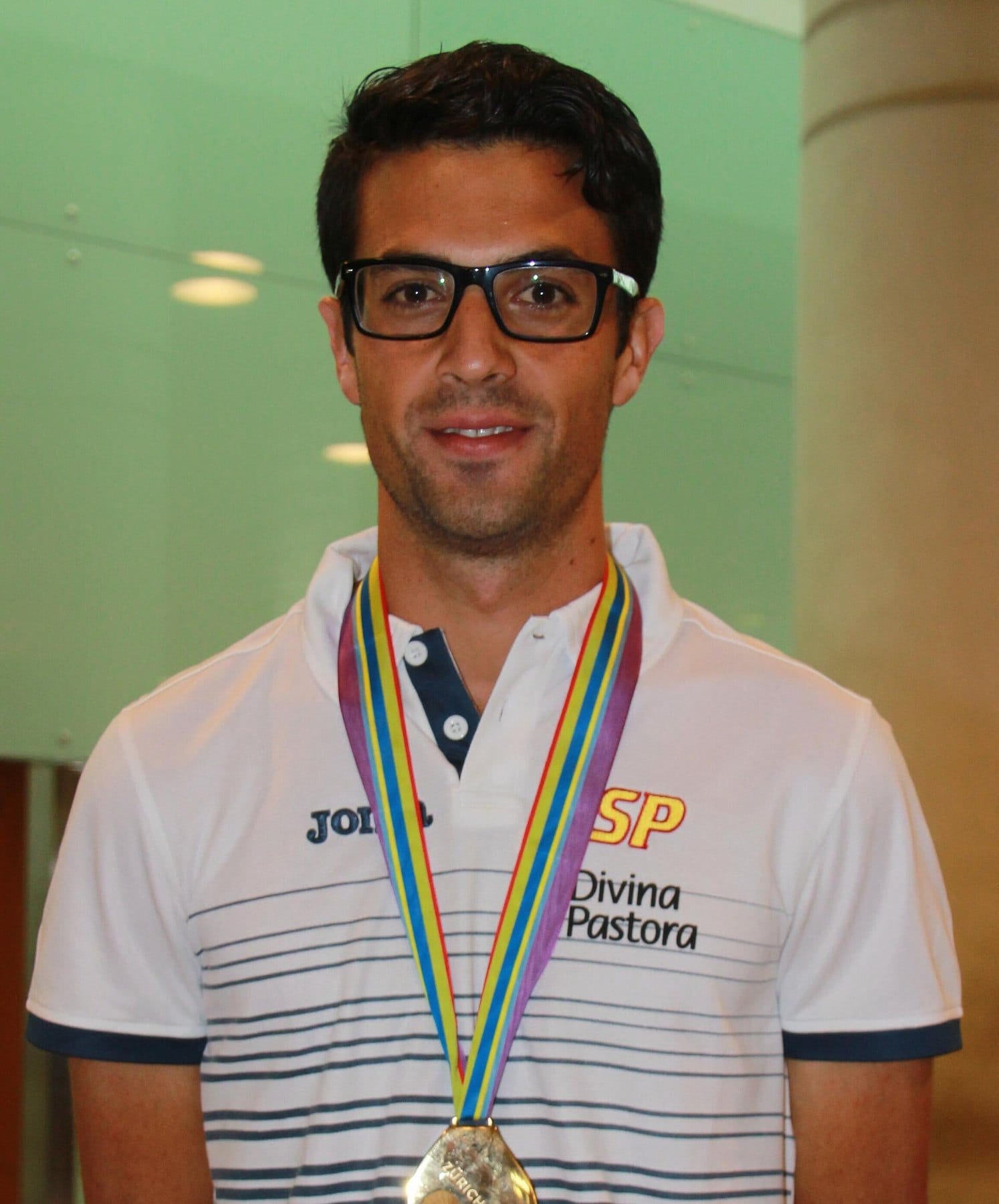 Miguel Angel Lopez arriving at Barcelona airport in the Joma Spain kit after winning the 20 km walk at the 2014 European Championships