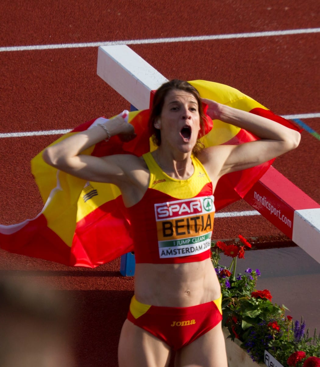 Ruth Beitia holding the Spanish flag after winning the high jump at the 2016 European Championships in Amsterdam