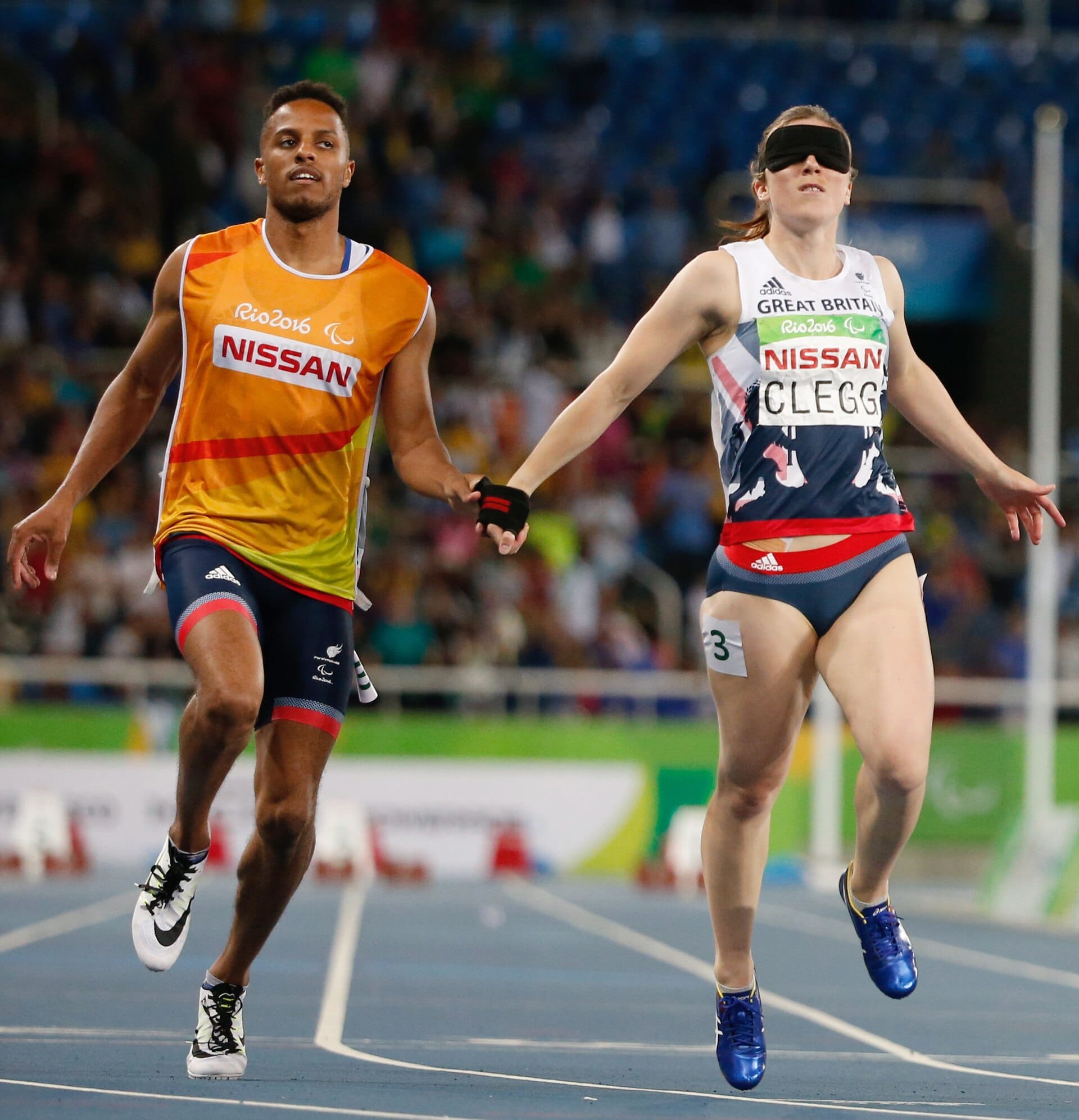 Libby Clegg running with her guide Chris Clarke in the 100 m T11 at the Rio 2016 Paralympics